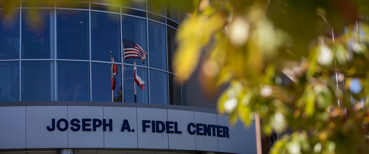 Hero Image of Fidel Center with leaves in the foreground