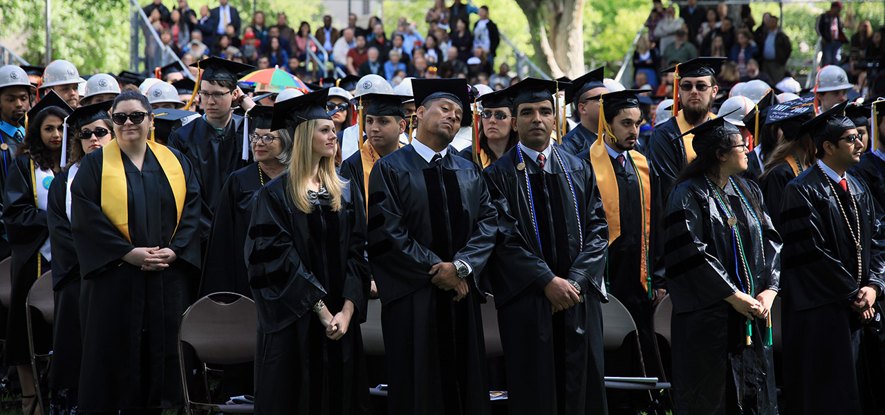 Hero Image of students standing at graduation.
