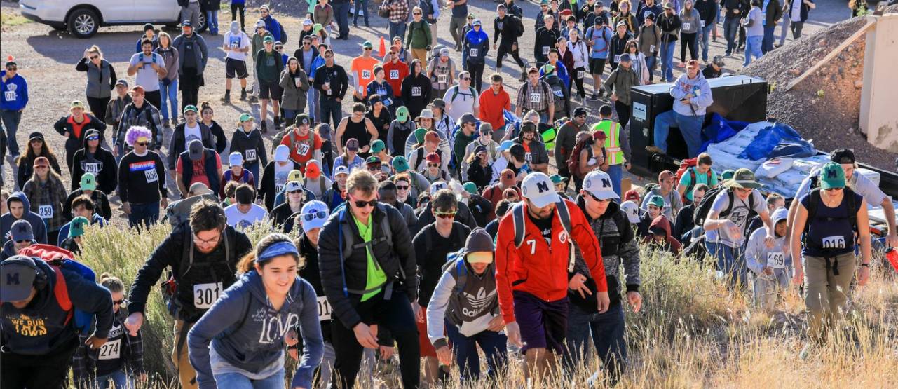 Students climbing "M" Mountain during the "Paint The M" Event for NMT 49ers