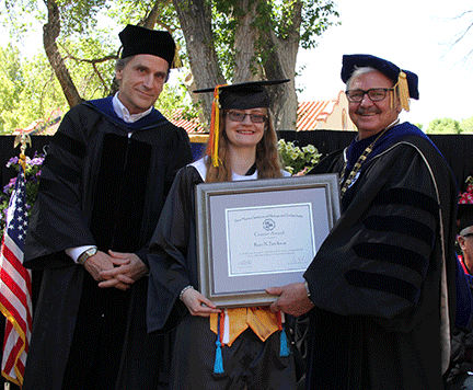 Kari Erickson with President Stephen Wells and VP Doug Wells