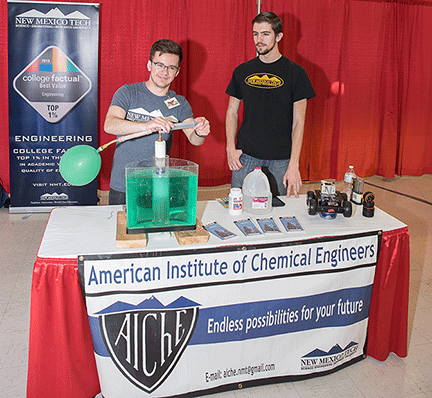 Two Tech students staff a booth 