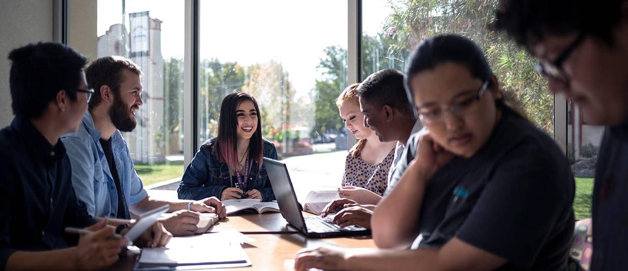 A group of students studying at a table