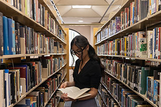 Student reading at the Library
