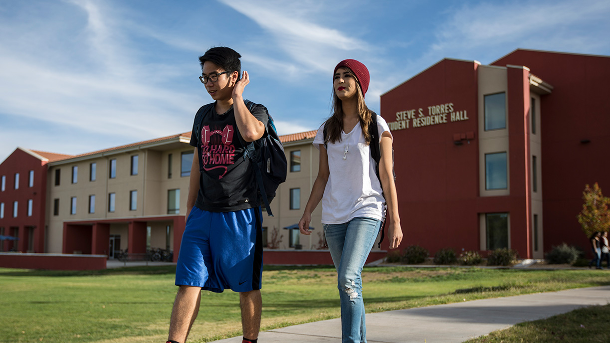 Students walking in front of student housing