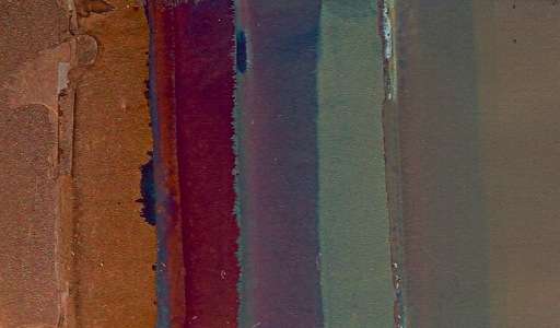 A slide with a variety of colored copper oxide films on it.