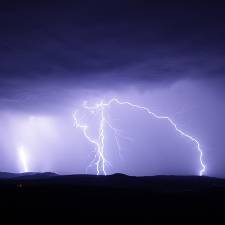 Cloud to ground lightning strike; four distinct strikes are visible
