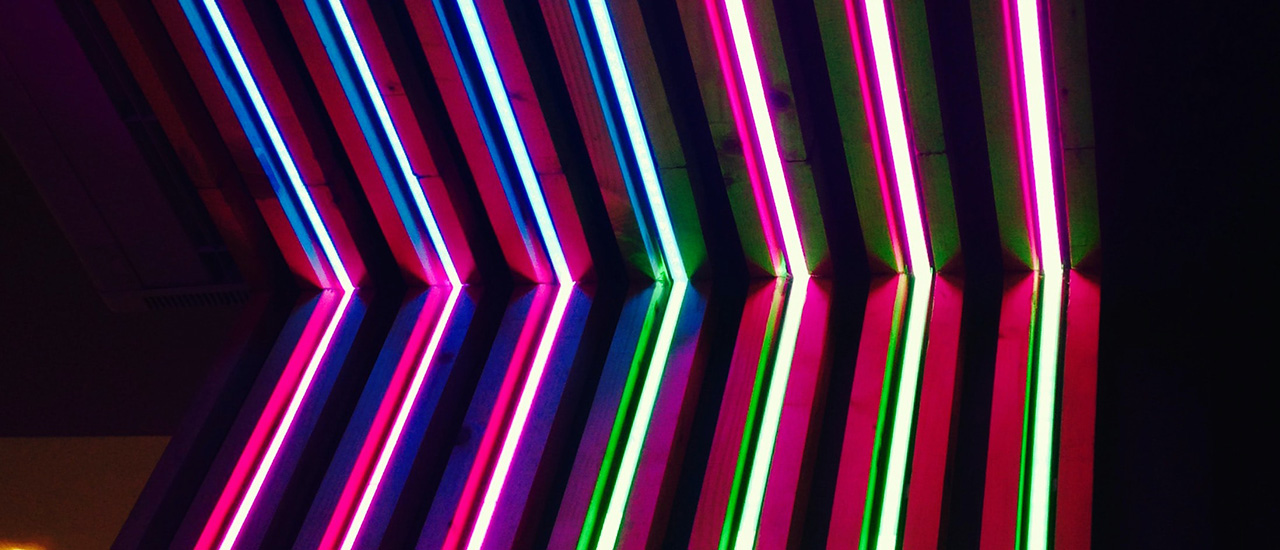 Neon lights against a black wall