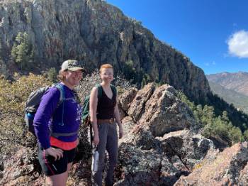 Magdalen Grismer, left, a geochemistry doctoral student, and George Pharris, a geosciences major at Smith College in Northampton, Massachusetts, enjoy the vista from the Mesa Trail in the Cibola National Forest
