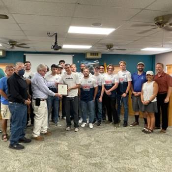 Rugby team with Socorro County officials