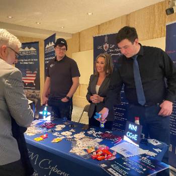 Cybersecurity Center of Excellence table at the Roundhouse