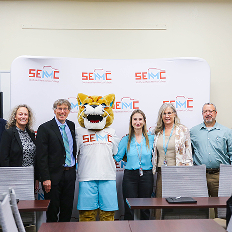 Leaders from the Southeast New Mexico College (SENMC) and the New Mexico Institute of Mining and Technology (NMT) at a signing ceremony of a partnership between the two institutions.