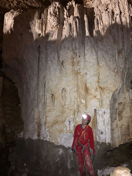 Zoe Havlena poses in front of an underground gypsum deposit 