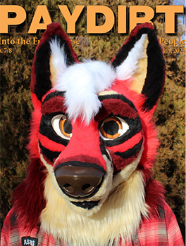 Close up image of a person wearing a red fur suit.