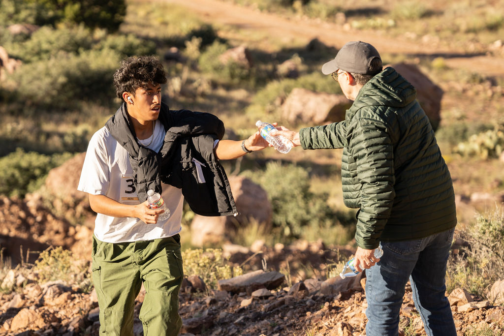 M Mountain Run Dean of Students Handing Out Water